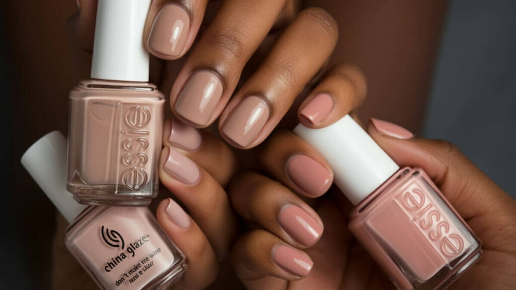Top Nude Nail Polishes for Dark Skin (Essie Ballet Slippers, OPI Tiramisu for Two, Sally Hansen Cozy Up, Zoya Marnie, Essie Topless & Barefoot, China Glaze Don’t Make Me Wine, Orly Platinum, Rev