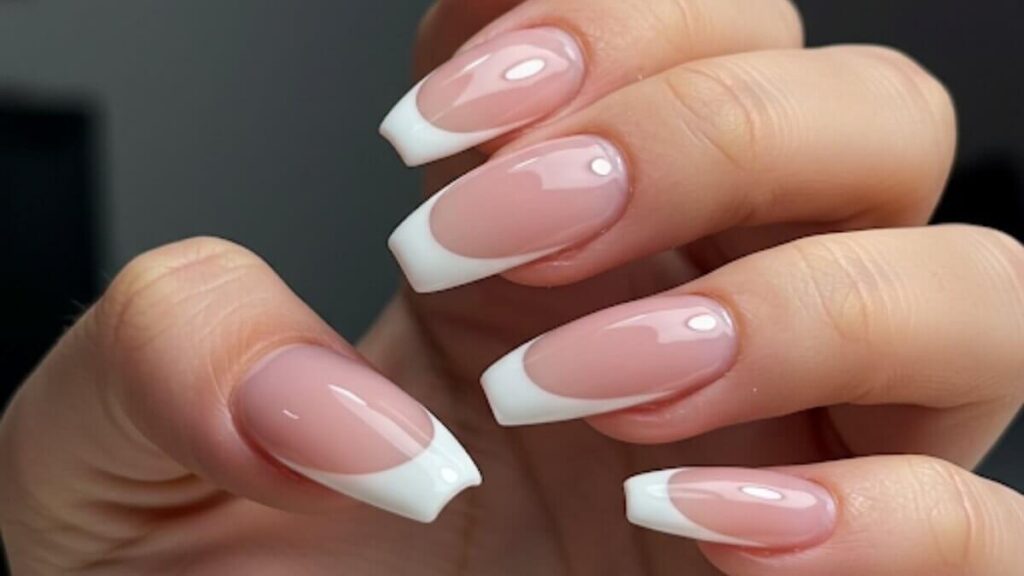 Classy graduation nails featuring simple and timeless French tips perfect for a polished look