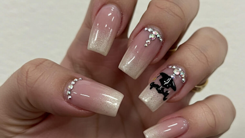 Classy graduation nails with subtle rhinestone embellishments for a fancy and elegant look